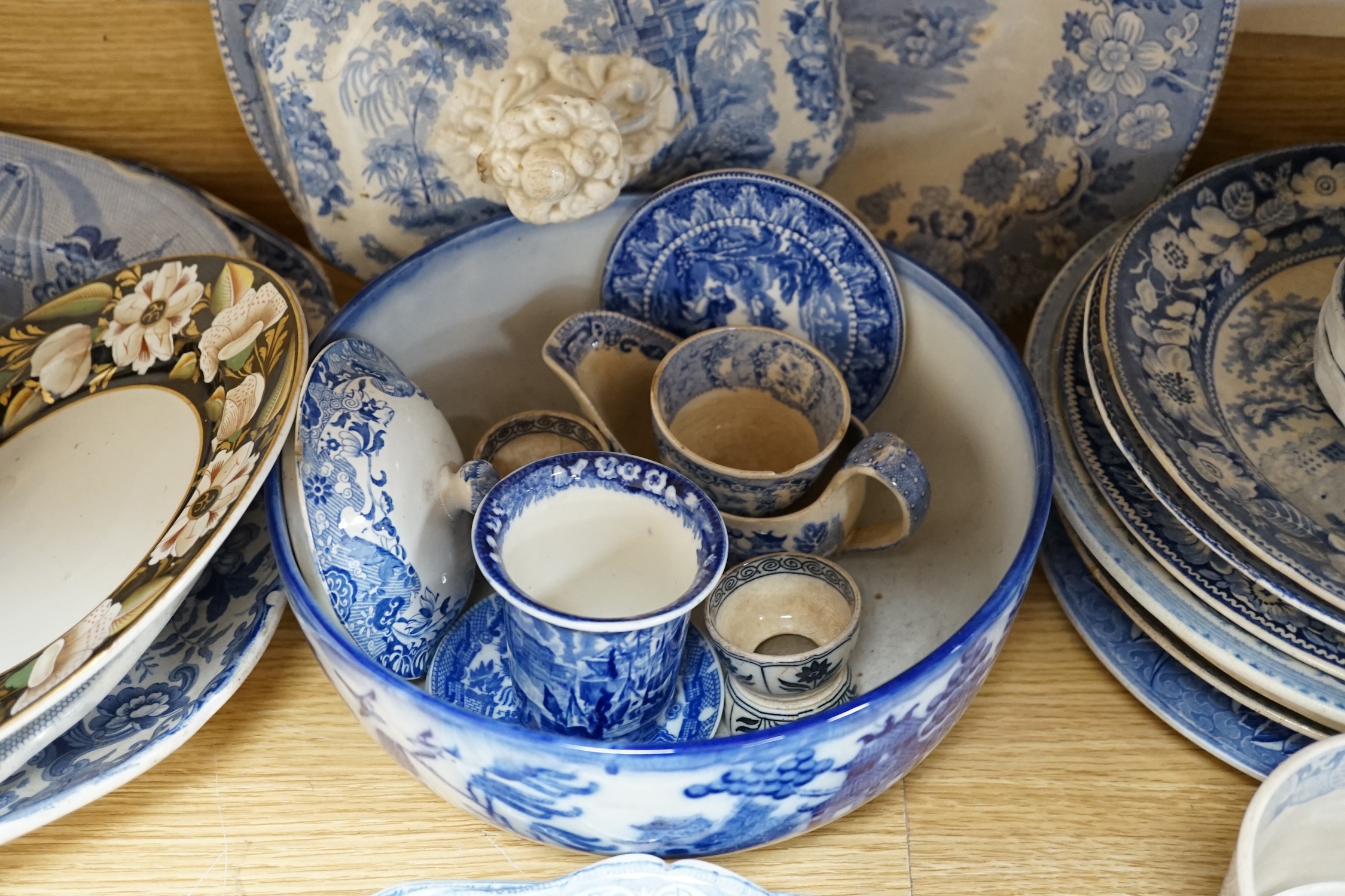 A collection of mixed blue and white dinnerware including Masons Ironstone, mostly plates and jugs. Condition - varies, poor to fair